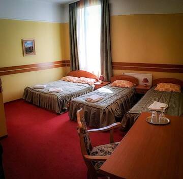 Фото номера Четырехместный номер Отель Szarvas Hotel г. Одорхею-Секуеск 2